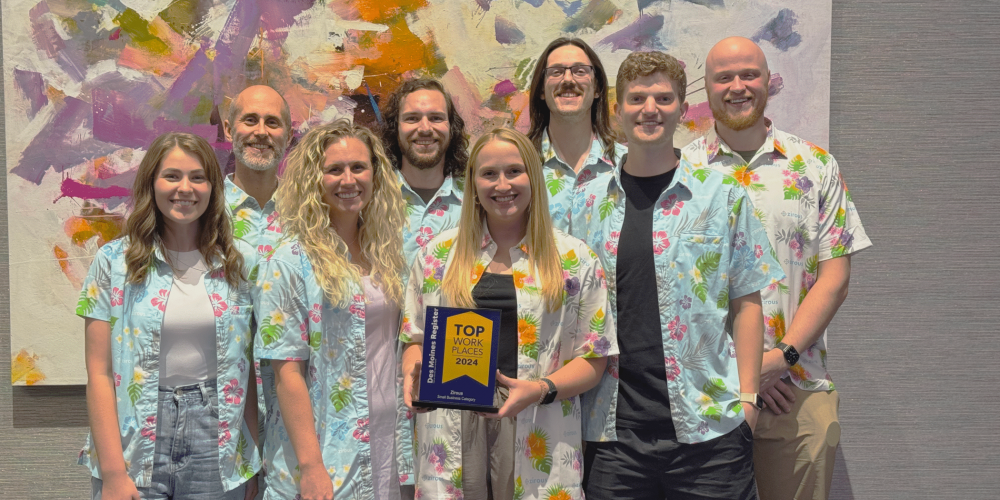 Zirous Employees Holding The Award For Top Workplaces Of 2024