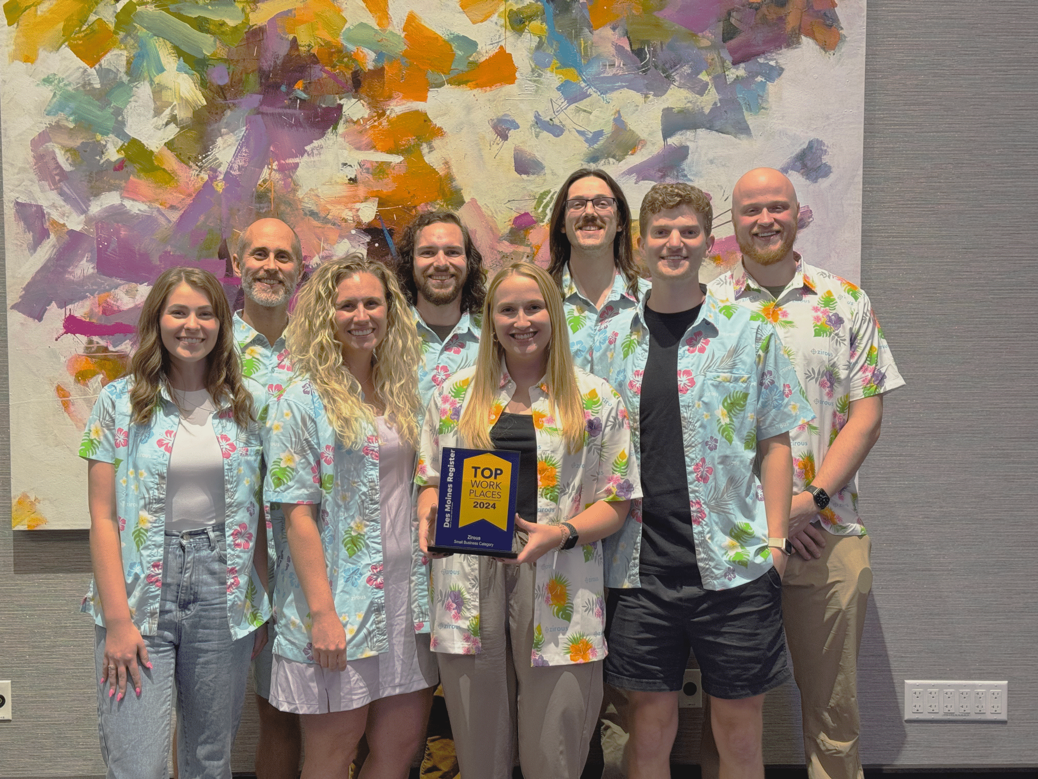 Zirous Employees Holding The Award For Top Workplaces Of 2024